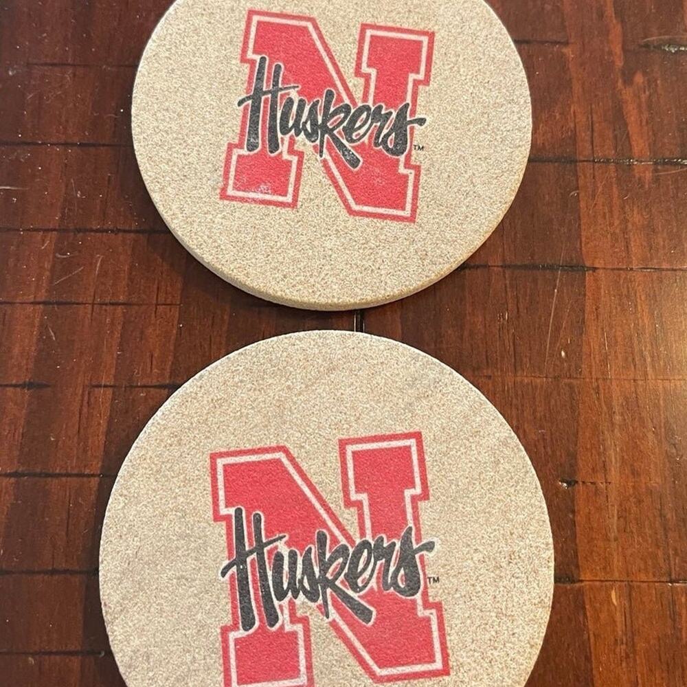 Set of 2 Nebraska Huskers stone coasters like new
